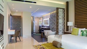 A modern hotel room with a large bed, a desk, and a bathroom visible through an open door. - Enjoy 2026 Christmas Week in a 3-bdm Loft with Rooftop Terrace at Garza Blanca (Cancún)
