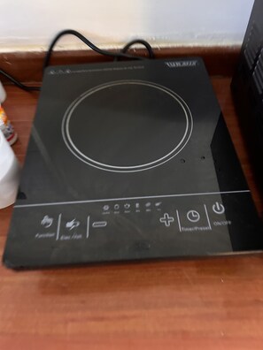 Control panel with a circular interface and various buttons and indicators.