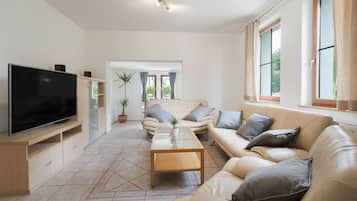 Comfort Villa, Garden View | Living area | 140-cm LED TV with cable channels, Netflix, streaming services