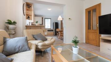 Comfort Villa, Garden View | Living area | 140-cm LED TV with cable channels, Netflix, streaming services