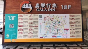 A hotel sign with a map and information. - GALA INN (Tainan)