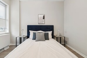 1 bedroom, desk, iron/ironing board, travel crib