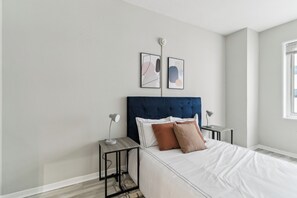 Desk, iron/ironing board, travel crib, bed sheets