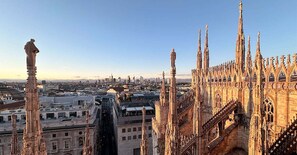 A cathedral with intricate Gothic architecture, including spires and detailed stonework. - Guesthouse - Metro M1 Sesto Rondò (Sesto San Giovanni)