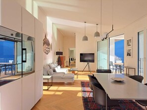Apartment, Lake View | Living area | 32-inch flat-screen TV with digital channels - Unique Gandria Attic (Lugano)