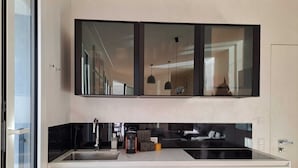 Apartment, Lake View | Private kitchen | Espresso maker, coffee/tea maker, fridge, oven - Unique Gandria Attic (Lugano)