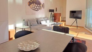 Apartment, Lake View | Living area | 32-inch flat-screen TV with digital channels - Unique Gandria Attic (Lugano)