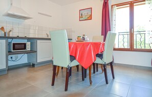 Enjoy meals in this cozy dining area with a microwave and ample seating for four.