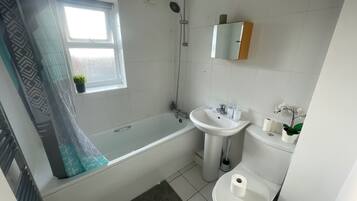 Apartment | Bathroom | Combined shower/tub, deep soaking tub, towels, toilet paper