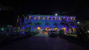 A hotel with a reception area, multiple floors, and a paved entrance. - Marino Beach Resorts (Kanthi)