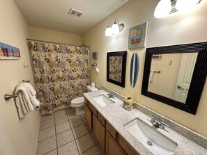 Shower, hair dryer, towels, shampoo