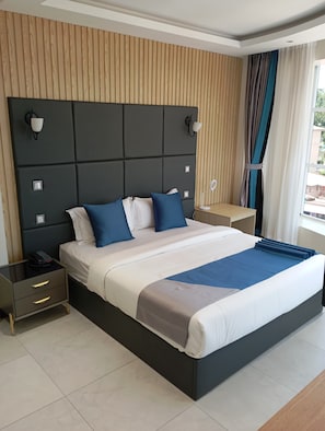 Deluxe Room | Premium bedding, in-room safe, individually furnished, desk