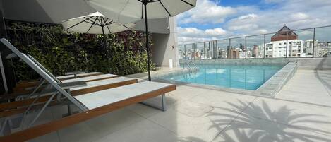 Outdoor pool, open 8:00 AM to 10:00 PM, sun loungers