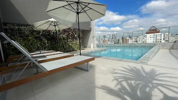 Outdoor pool, open 8:00 AM to 10:00 PM, pool loungers