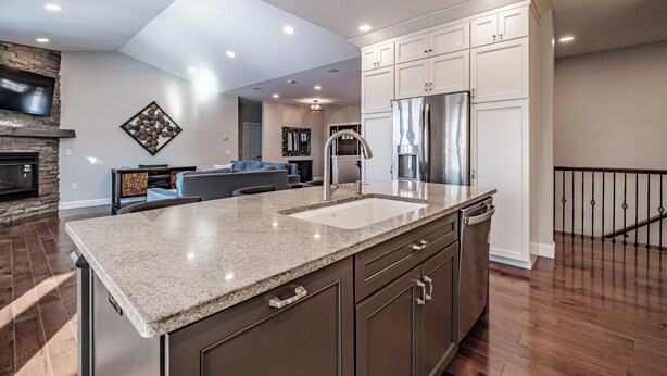 A modern kitchen with granite countertops, stainless steel appliances, and a built-in dishwasher. - Beautiful home located on the coveted Paradise Road in Bethel Maine (Bethel)