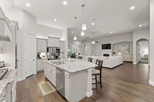 This beautiful 3200 SF single storey with loft backs onto a heavily treed forest