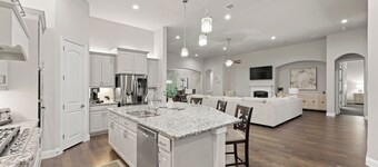 This beautiful 3200 SF single storey with loft backs onto a heavily treed forest