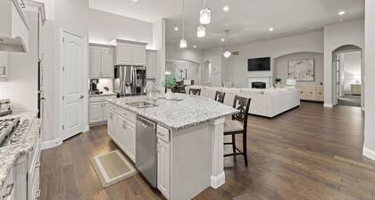 This beautiful 3200 SF single storey with loft backs onto a heavily treed forest