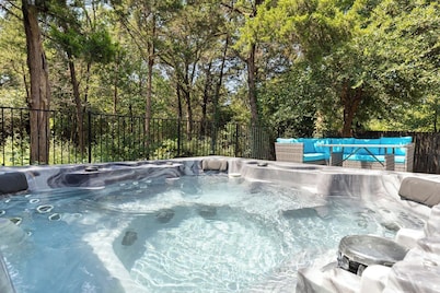 This beautiful 3200 SF single storey with loft backs onto a heavily treed forest