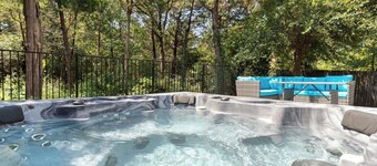 This beautiful 3200 SF single storey with loft backs onto a heavily treed forest