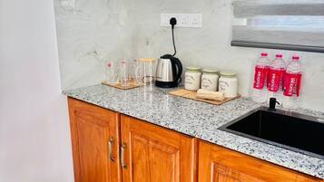 Fridge, electric kettle, cookware/dishes/utensils, spices