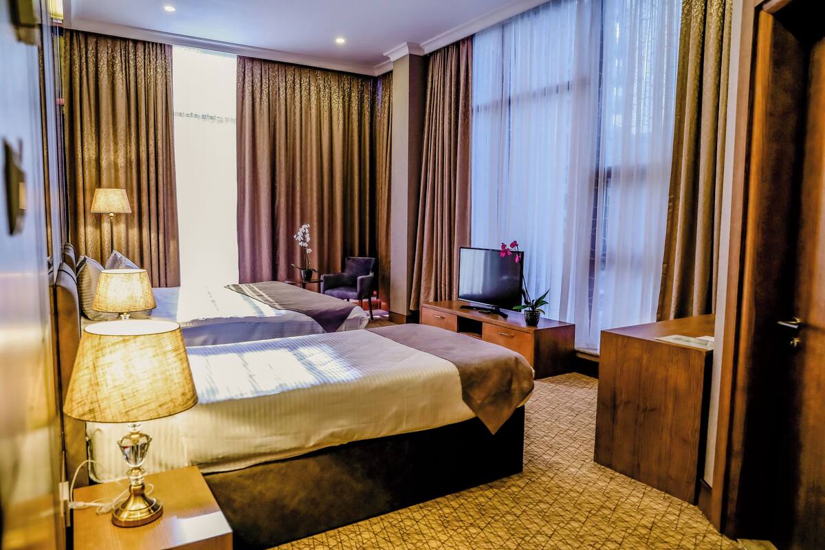 Family Triple Room, City View | In-room safe, blackout drapes, soundproofing