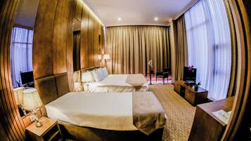 Family Triple Room, City View | In-room safe, blackout drapes, soundproofing, iron/ironing board