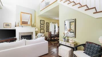 Smart TV, fireplace, books, printers