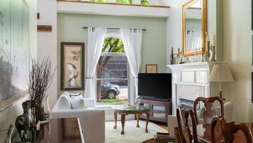 Smart TV, fireplace, books, printers