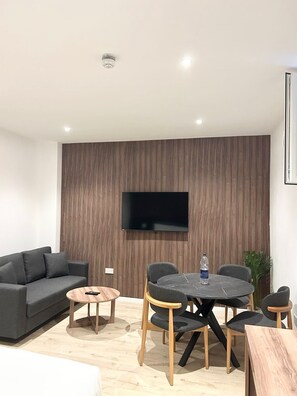 Suite estudio de lujo, 1 cama King size y sofá cama | Área de sala de estar