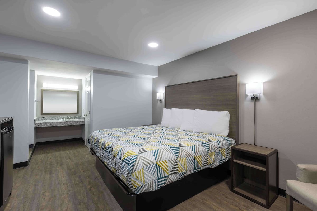 Desk, laptop workspace, blackout curtains, iron/ironing board