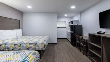 Desk, laptop workspace, blackout drapes, iron/ironing board