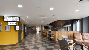 A hotel lobby with directional signs for amenities like bedrooms, gym, cinema, and study rooms. - For Students Only Cosy Ensuite Rooms With Private Bathrooms at Dobbie's Point in Glasgow (Glasgow)