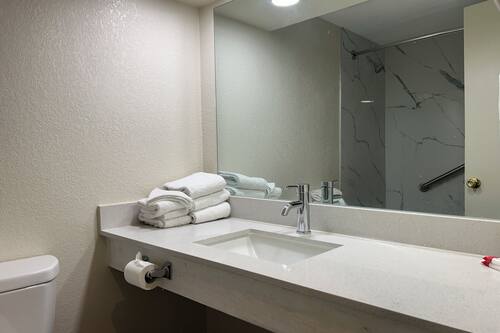 Combined shower/tub, hair dryer, towels, soap