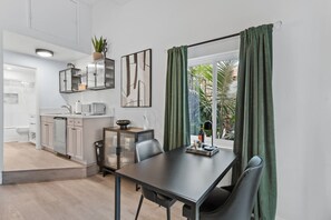 Coffee/tea maker, toaster, cookware/dishes/utensils, dining tables