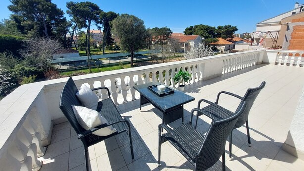 A balcony with outdoor furniture, a view of the surrounding area, and a railing. - Charming 3-bedroom apartment with AC, Pool, WiFi in beautiful Biograd na Moru (Biograd na Moru)