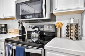 Coffee/tea maker, fridge, microwave, oven