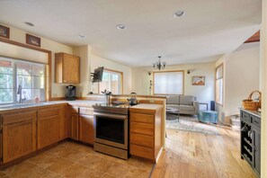 Fridge, dishwasher, coffee/tea maker, cookware/dishes/utensils