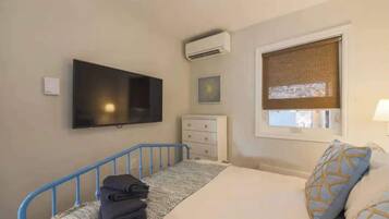 Queen bedroom with smart TV