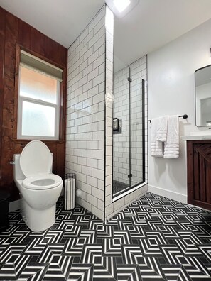 Shower, hair dryer, towels, soap