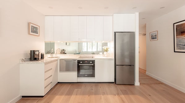 Fridge, stovetop, dishwasher, coffee/tea maker