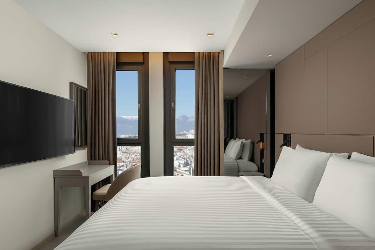 Suite, 1 Bedroom, City View | In-room safe, desk, blackout curtains, iron/ironing board