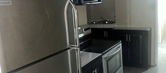 Sleeps 9 • 4 Queen Beds • Charming 2BR Apartment with AC & WiFi