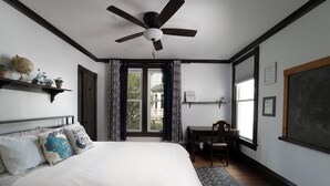 A bedroom with a bed, a desk, a chair, a ceiling fan, and a window with curtains. - The 2,400 sq. ft. Plymouth Paddock near Road America, 4 bedrooms, 2.5 bathrooms  (Plymouth)