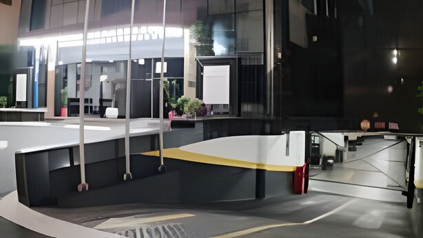 A modern building with a unique cylindrical design, large windows, and a visible entrance area with a ramp. - APARTAMENTO MEU LAR LIBERDADE SP (São Paulo)