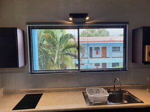 Fridge, microwave, stovetop, coffee/tea maker