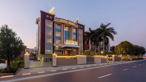 A hotel with a prominent sign reading "Park Grace" and "DHS Hotels". - DLS Park Grace (Haridwar)