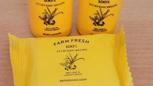 Two bottles of Farm Fresh 100% Ayurvedic Recipe body lotion and a packet of Farm Fresh 100% Ayurvedic Recipe refreshing soap. - Hotel Aalishan (Varanasi)