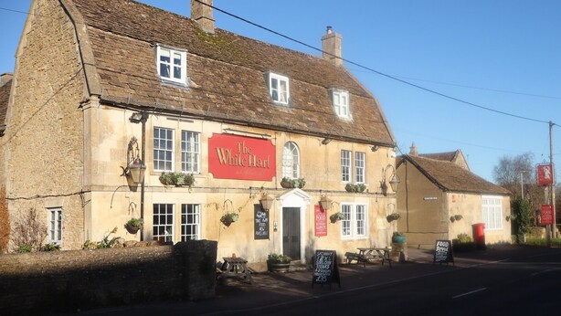 A traditional stone building with a sign reading "The White Hart". - The White Hart (Melksham)