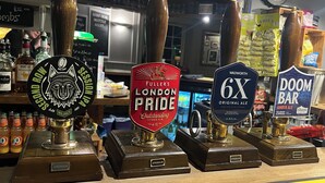 A bar with four beer taps labeled 'WADWORTH 6X', 'DOOM BAR', 'FULLER'S LONDON PRIDE', and 'WOLFPACK'. - The White Hart (Melksham)